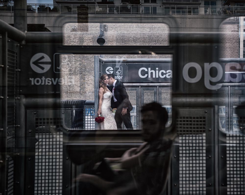 Bride and groom through train window at Chicago L