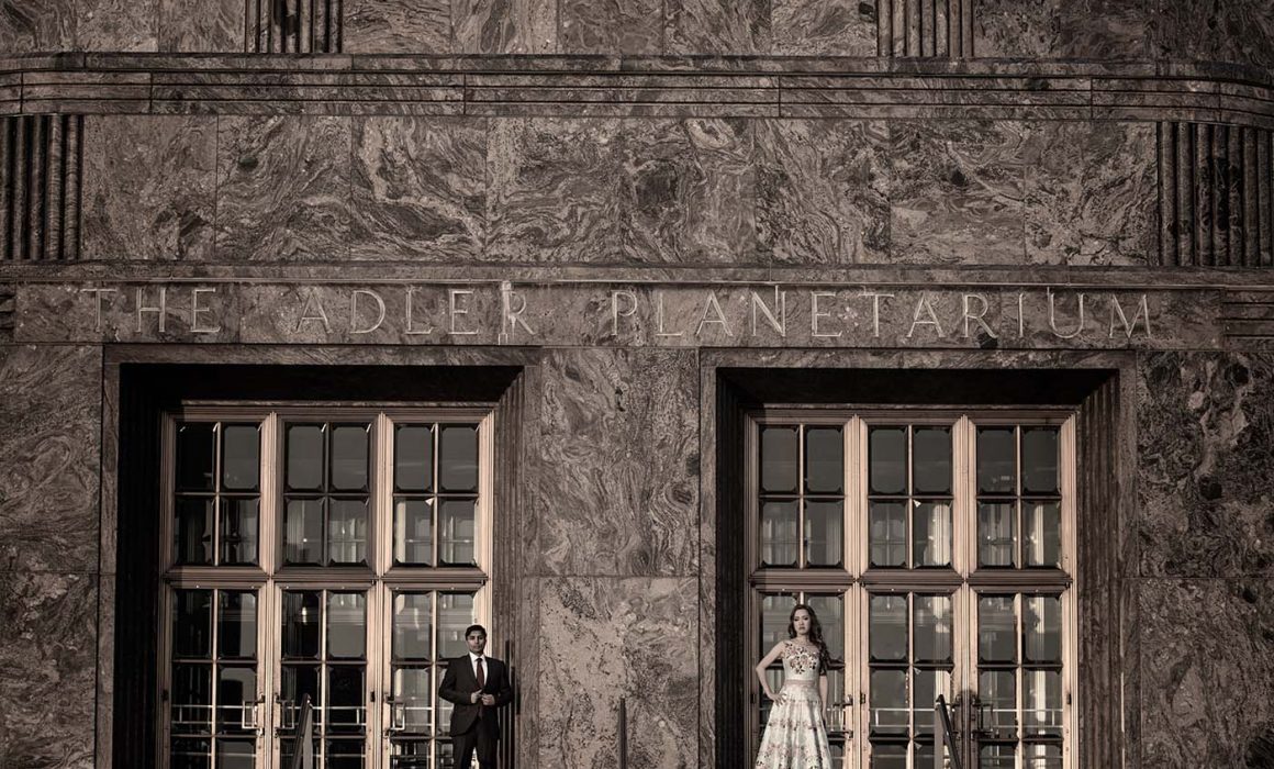 Bride and groom in front of Adler Planetarium