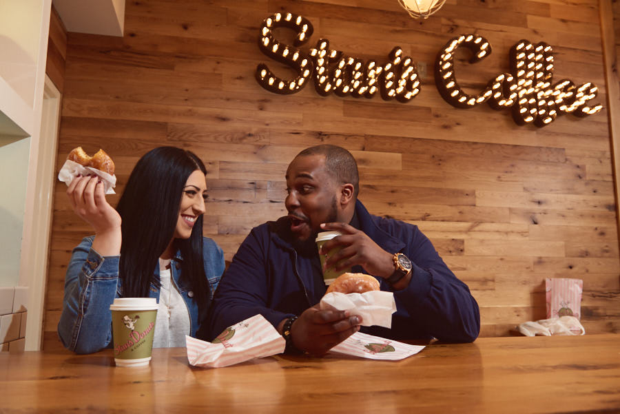 Cute engagement moment at Stans Donuts in Wicker Park