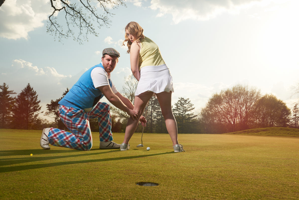 Funny golf course engagement portrait