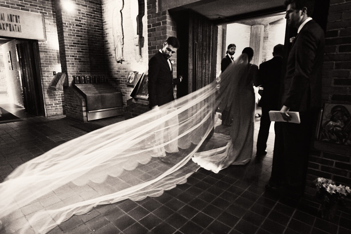 Bride walking down the aisle with long veil