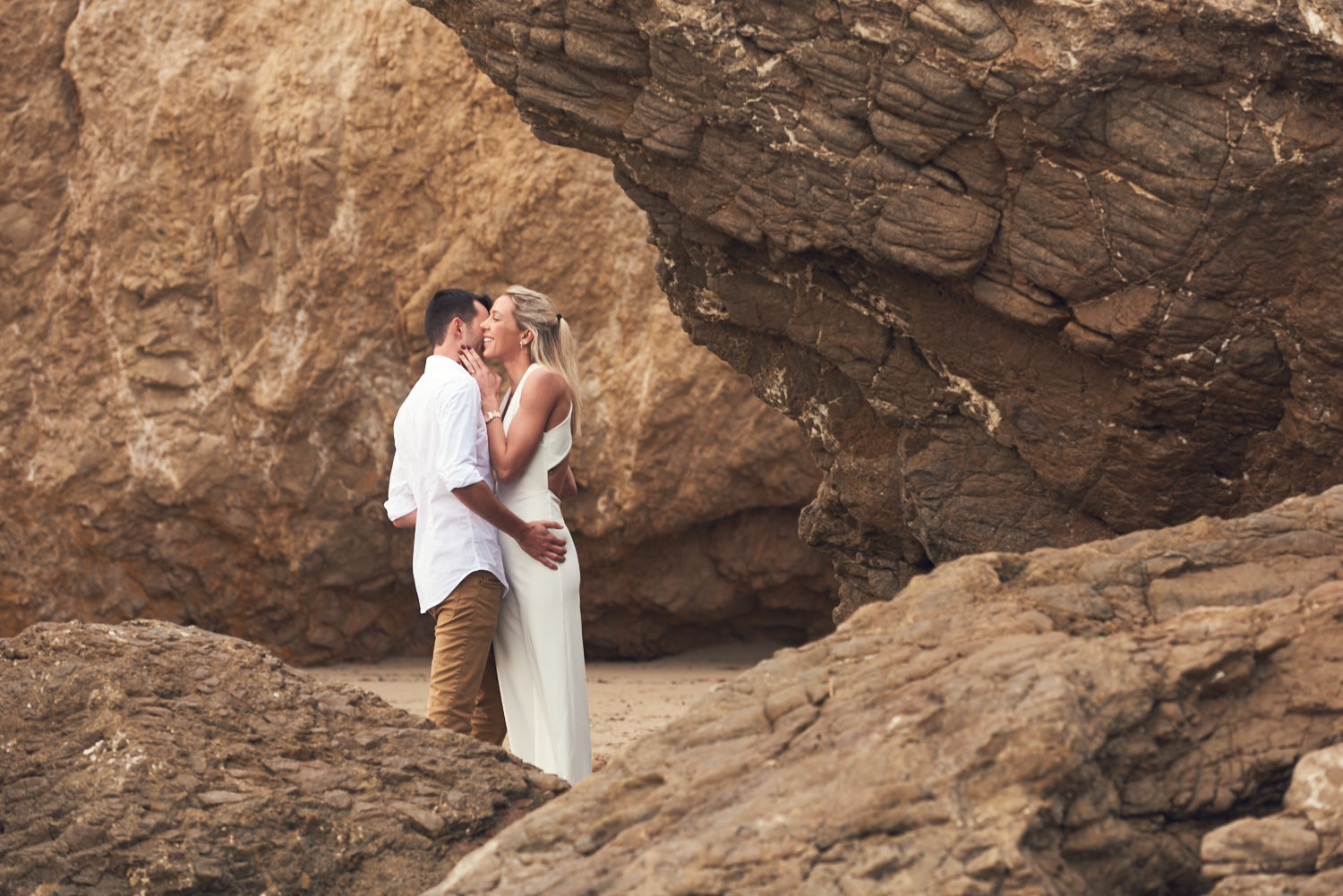 Engagement photos near rocks and cliffs